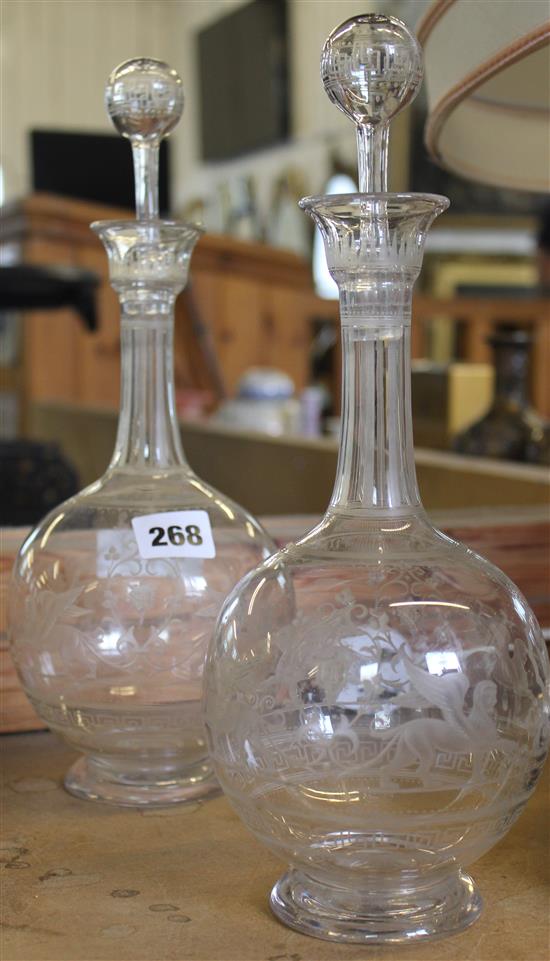 Pair of engraved glass decanters with stoppers